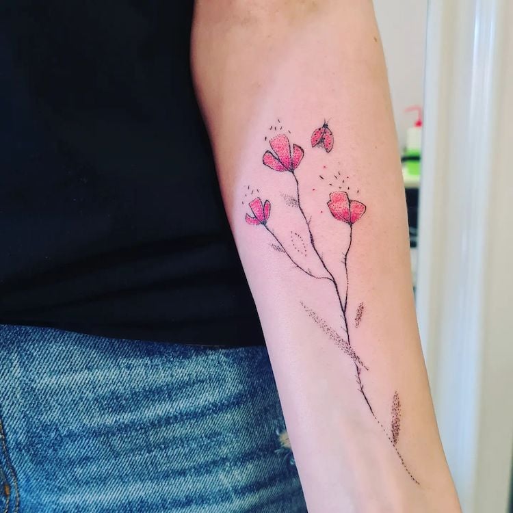 feminine poppy tattoo with ladybug