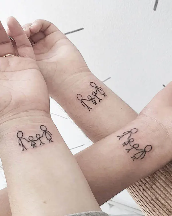 Matching family wrist tattoos by @atomic.sttudio